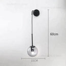 Retro modern glass smoked globe wall lamps for bedroom lighting by Decorbites