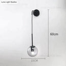 Retro modern glass smoked globe wall lamps for bedroom lighting by Decorbites
