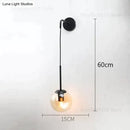 Retro modern glass smoked globe wall lamps for bedroom lighting by Decorbites