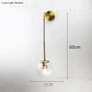 Retro modern glass smoked globe wall lamps for bedroom lighting by Decorbites