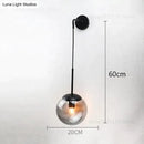 Retro modern glass smoked globe wall lamps for bedroom lighting by Decorbites