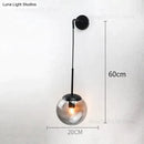 Retro modern glass smoked globe wall lamps for bedroom lighting by Decorbites