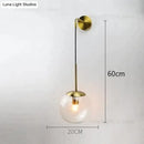 Retro modern glass smoked globe wall lamps for bedroom lighting by Decorbites