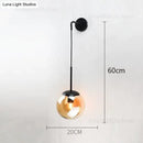 Retro modern glass smoked globe wall lamps for bedroom lighting by Decorbites