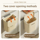 Ribbed cream and gray kitchen cabinet hanging trash by Decorbites