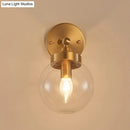 GobekUsa Rotatable Bedroom Wall Lamp in Brass with Clear Glass and Modernist Ball Design