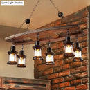 GobekUsa Rustic 6-Light Pendant Lantern: Clear Glass & Black, with Wooden Board