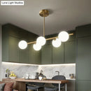 GobekUsa Sleek and Elegant Linear Gold Island Pendant Lighting with Spherical Glass Shades for Dining Table