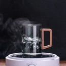 Sleek dark gray double walled glass tea cup with wooden lid kitchen by Decorbites