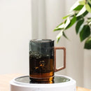 Sleek dark gray double walled glass tea cup with wooden lid kitchen by Decorbites