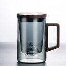 Sleek dark gray double walled glass tea cup with wooden lid kitchen by Decorbites