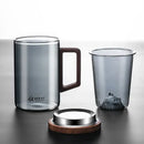 Sleek dark gray double walled glass tea cup with wooden lid kitchen by Decorbites