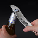 Sleek stainless steel garlic press with integrated spoon kitchen tool by Decorbites