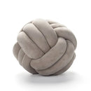 Soft pink velvet knotted ball round pillow for bedroom decor by Decorbites