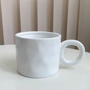 Textured blue ceramic coffee mug kitchen cup with round handle by Decorbites