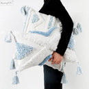 Textured blue & white geometric cushion cover with tassels living room by Decorbites