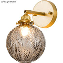 GobekUsa Textured Glass Ball Wall Light with Elegant Gold Wall Mount and Adjustable Joint