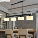 GobekUsa 4-Light Traditional Drum Island Pendant in Black for Dining Room with White Glass Shades