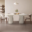 Troia Light Travertine Oval Dining Table with Fluted Round Legs (W)40" (L)75" (H)30" living room view beige color chairs