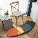 Tufted beige textured dining chair cushions for dining room by Decorbites
