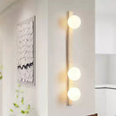 Vertical Travertine Ball Wall Sconce