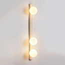 Vertical Travertine Ball Wall Sconce