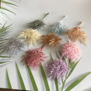 Vibrant multicolored dried flower bouquets in white vase living room by Decorbites
