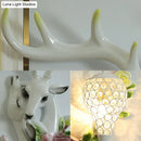 GobekUsa Loft Style Wall Mounted Sconce with Clear Crystal Shade, Blue/Gold Finish and Deer Head Accent