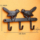 Vintage black iron bird hook wall shelf for entryway storage by Decorbites
