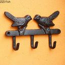 Vintage black iron bird hook wall shelf for entryway storage by Decorbites
