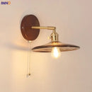 Vintage brass and amber glass wall sconce stair light with pull chain by Decorbites