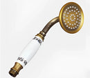 Vintage brass and ceramic handheld shower head bathroom fixture by Decorbites