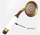 Vintage brass and ceramic handheld shower head bathroom fixture by Decorbites