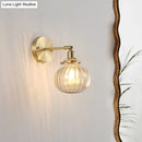 GobekUsa Champagne/Clear Prismatic Glass Single Sconce Gold Wall Light - Minimalist Globe Design