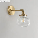 GobekUsa Champagne/Clear Prismatic Glass Single Sconce Gold Wall Light - Minimalist Globe Design