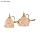 GobekUsa Modern Floral Wall Sconce with Amber Glass, Brass Finish, 2/3 Bulbs - 16.5"/24.5" W