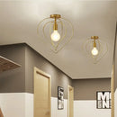 Vintage gold metal cage pendant light for restaurant and bar by Decorbites