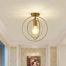 Vintage gold metal cage pendant light for restaurant and bar by Decorbites