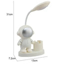 White astronaut desk lamp with pencil sharpener for bedroom study by Decorbites