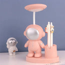 White astronaut desk lamp with pencil sharpener for bedroom study by Decorbites