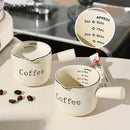 White ceramic measuring cups with silver rim – kitchen espresso tools by Decorbites