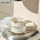 White ceramic measuring cups with silver rim – kitchen espresso tools by Decorbites