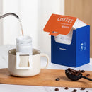 White disposable coffee filter bags kitchen pour over setup by Decorbites