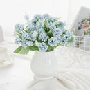 White hydrangea bouquet in ribbed glass vase for living room decor by Decorbites