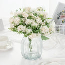 White hydrangea bouquet in ribbed glass vase for living room decor by Decorbites
