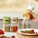Yellow and clear glass spice dispenser kitchen salt grinder by Decorbites