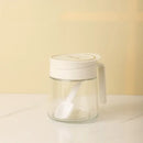 Yellow flip top glass seasoning jar with spoon kitchen spice shaker by Decorbites