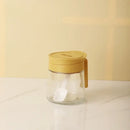 Yellow flip top glass seasoning jar with spoon kitchen spice shaker by Decorbites