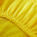 Yellow ribbed fleece chair cover for dining room seat protection by Decorbites
