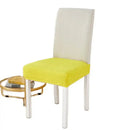 Yellow ribbed fleece chair cover for dining room seat protection by Decorbites